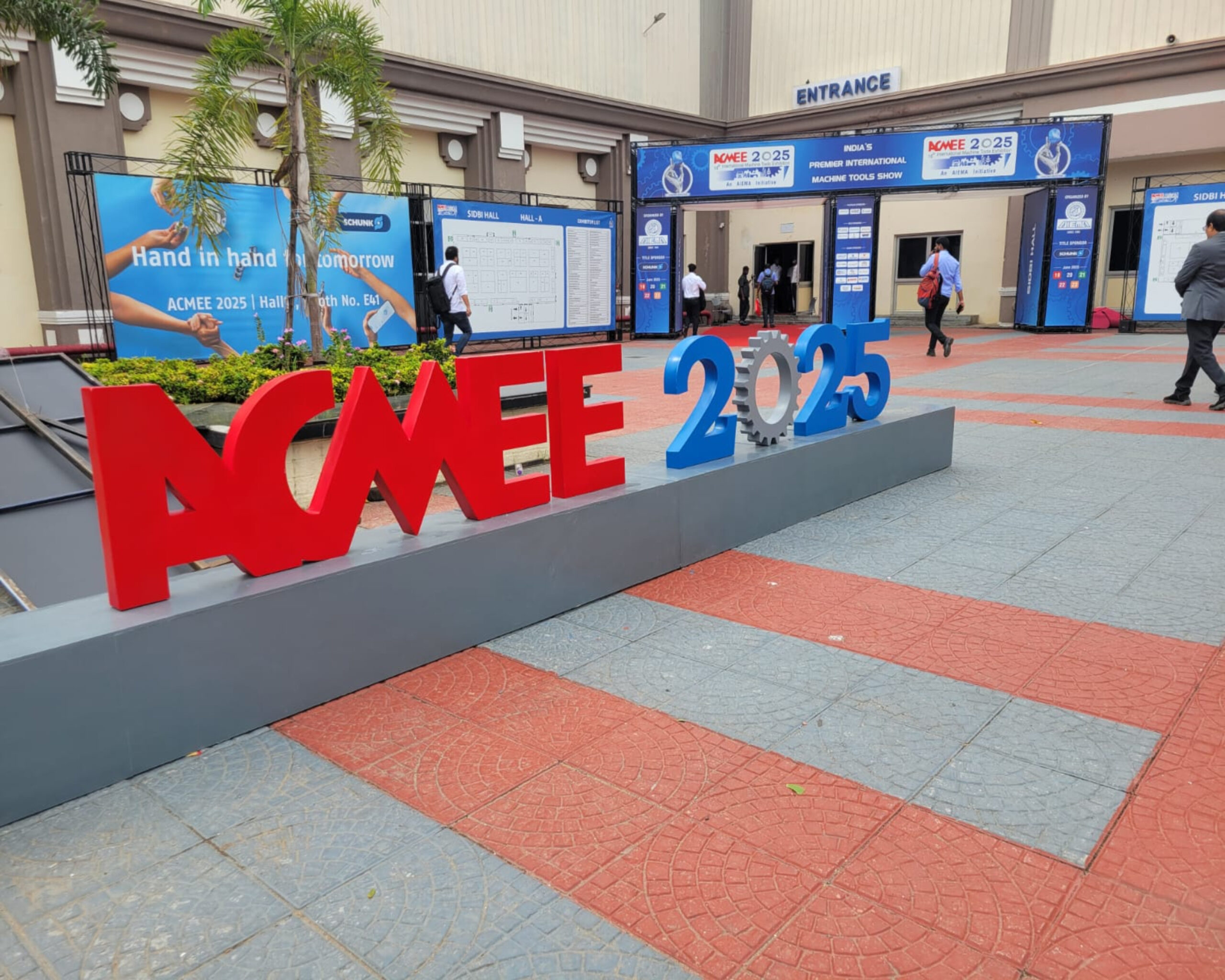ELITECH booth setup at ACMEE 2025 with CNC machines on display