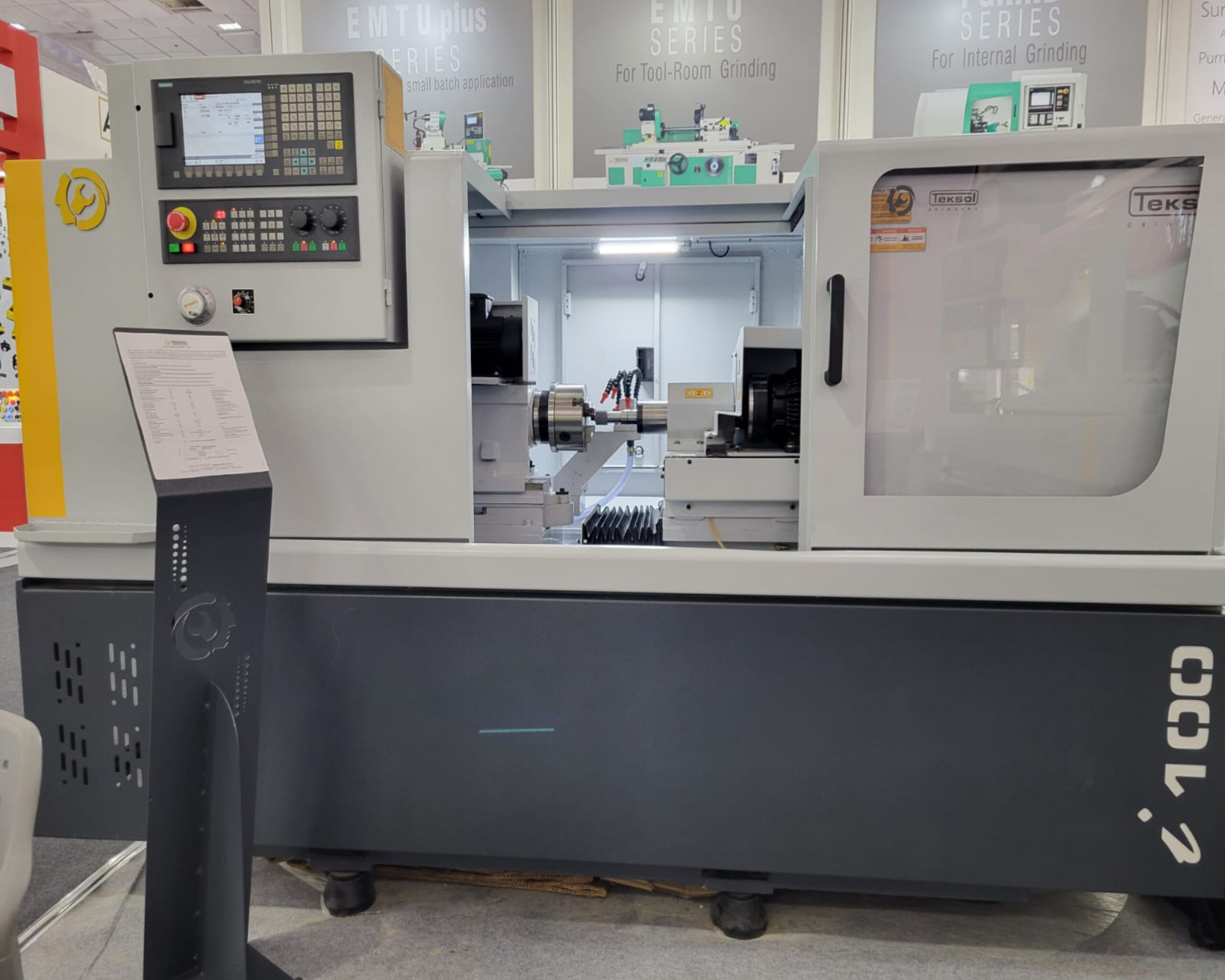 Visitors examining the CNC Internal Grinding Machine
