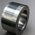 SURFACE FINISH Cylindrical metal component with dual surface finishes on smooth gray background